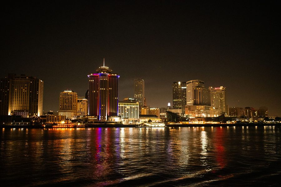 New Orleans skyline lit at night across the Mississippi River