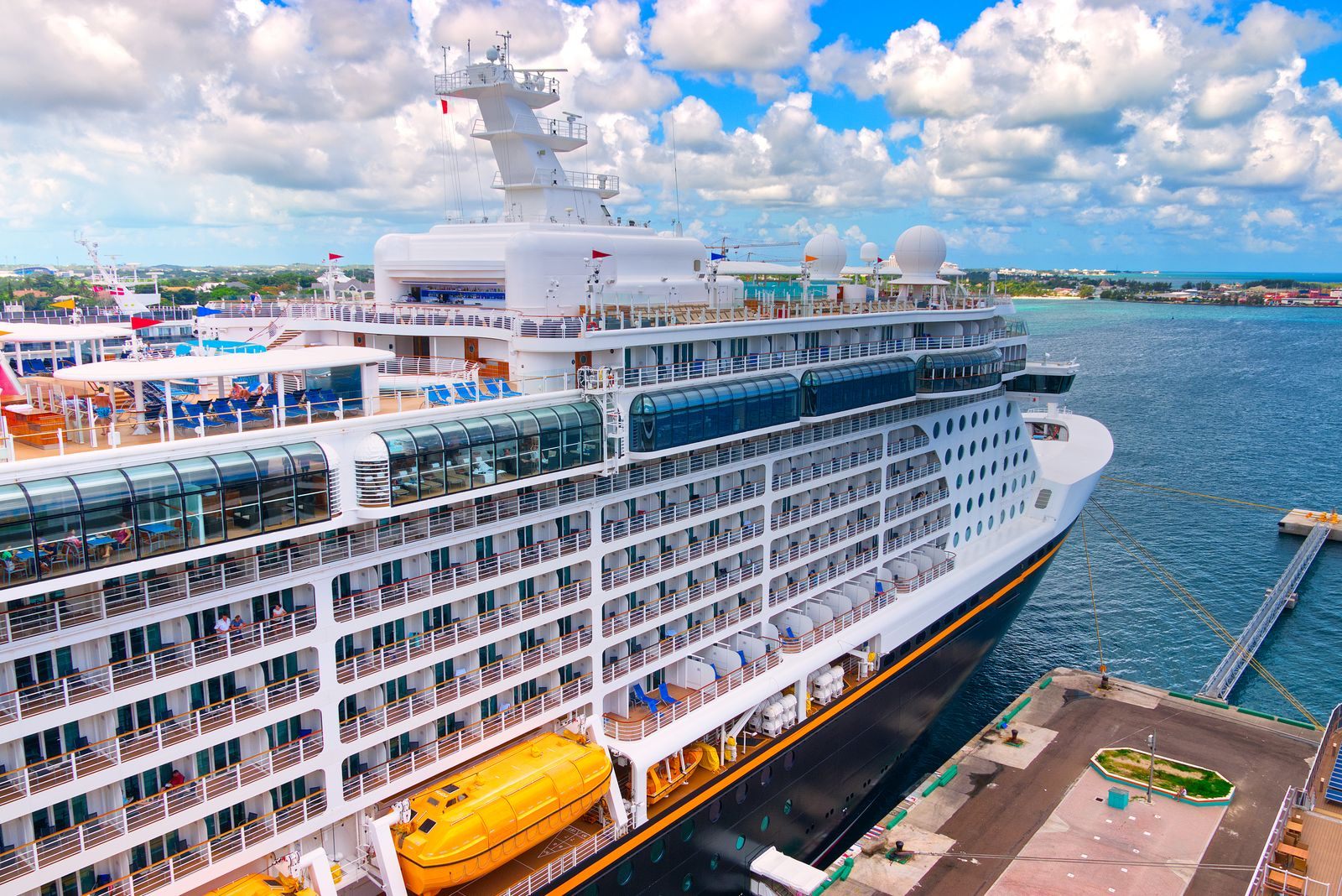 Cruise ship alongside a pier seen from above, the kind of call listed on a cruise port schedule for 2027